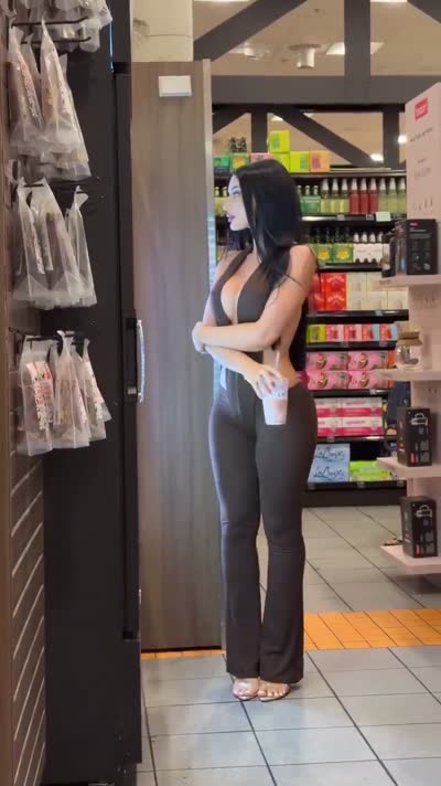 Raven-haired in a fitted black jumpsuit