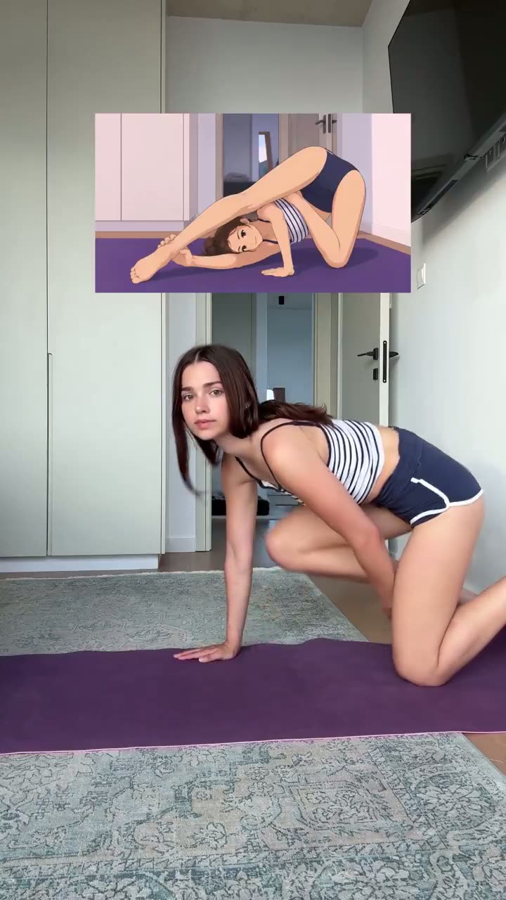Brunette in a navy swimsuit stretching on a yoga mat