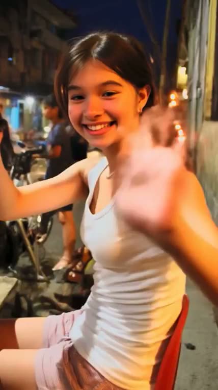 Brunette in a white tank top at a night market