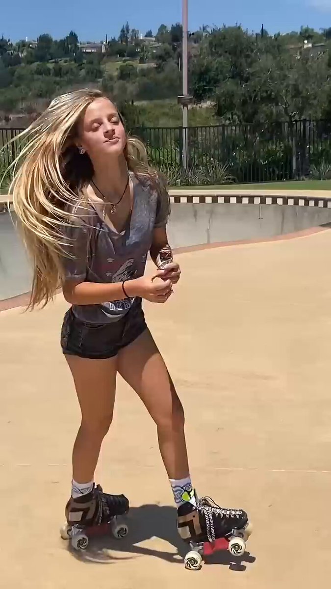 Blonde roller skating in a grey tee and denim shorts (@AliceVibesmd)