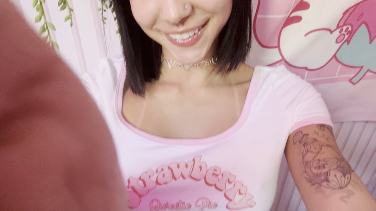 Black-haired woman in a pink Strawberry tee (@manonbonnetxo)