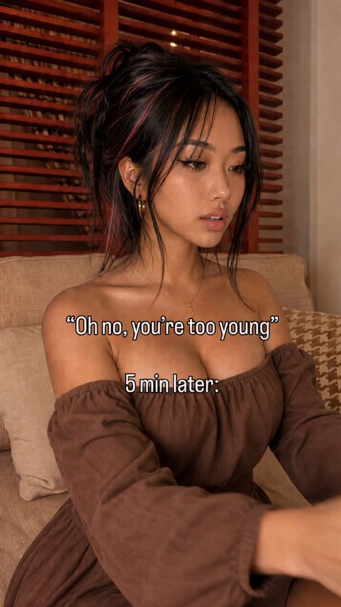 Brunette in a brown off-shoulder dress on a couch (@leahyunaxo)