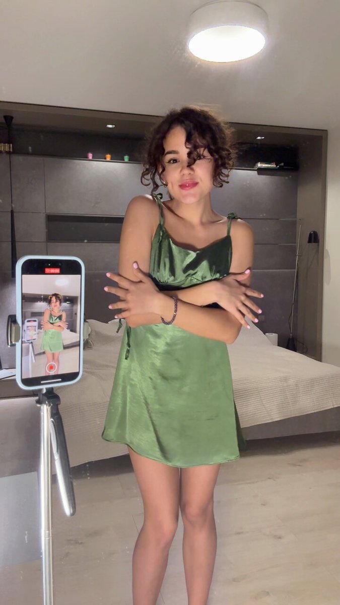 Brunette in a green satin slip dress by a phone tripod (@al_as40915)