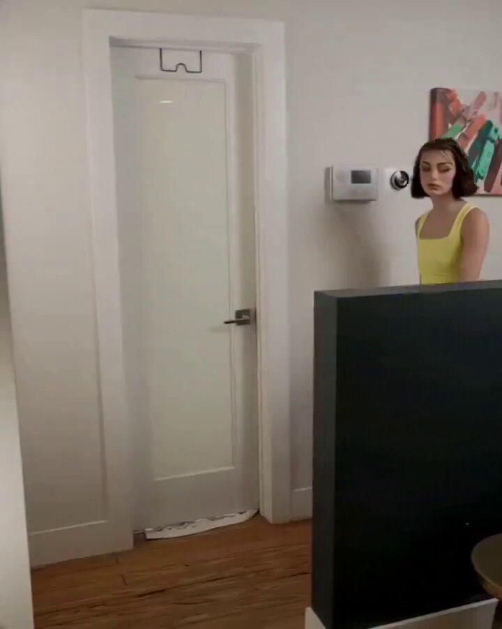 Brunette in a yellow tank peeking through a door (@Mauricioxarpi)