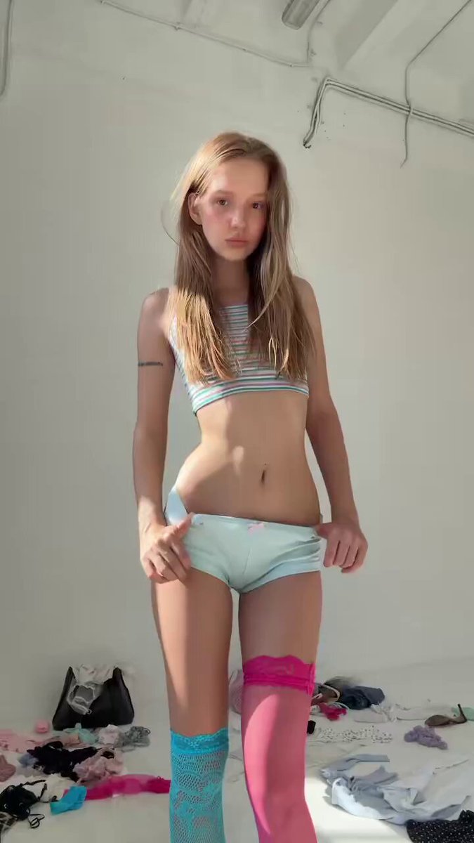 Blonde in a striped crop top, mint shorts, and mismatched lace stockings (@tomzyqafk1)