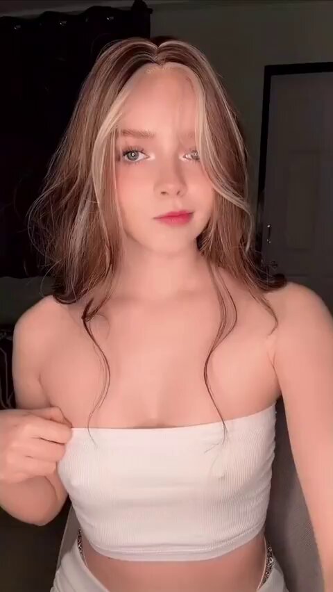 Brunette with blonde highlights in a white tube top (@tamem_aldosri)