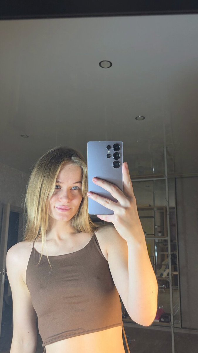 Blonde in a brown crop taking a mirror selfie (@ImamSuicide)