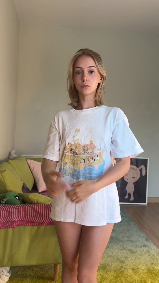Blonde in an oversized white cartoon T-shirt
