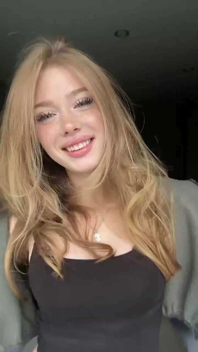 Blonde in a black square-neck tank top