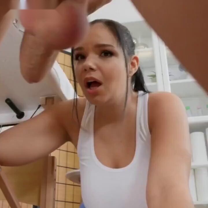 Brunette in a white tank top looking up in a kitchen (@little_sis1_)