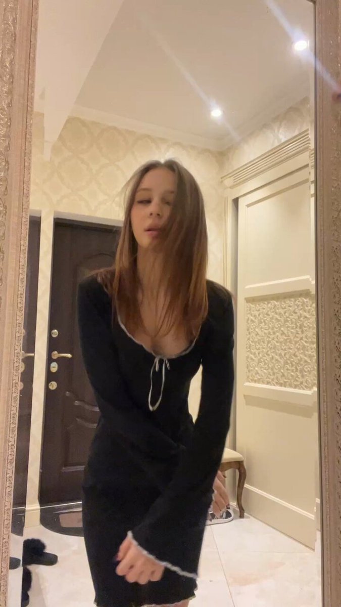 Brunette in a black long-sleeve mini with white trim taking a mirror selfie (@Jenniferzsdh)