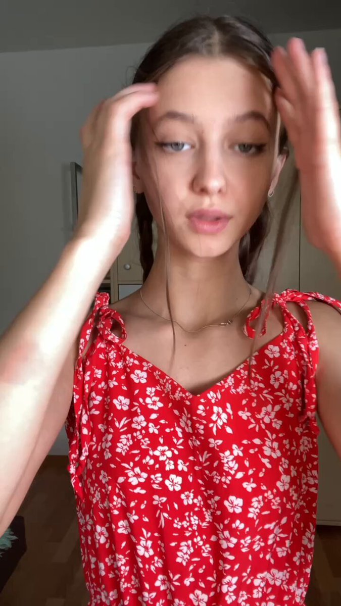 Brunette with pigtails in a red floral dress (@CharlieCrfmi)