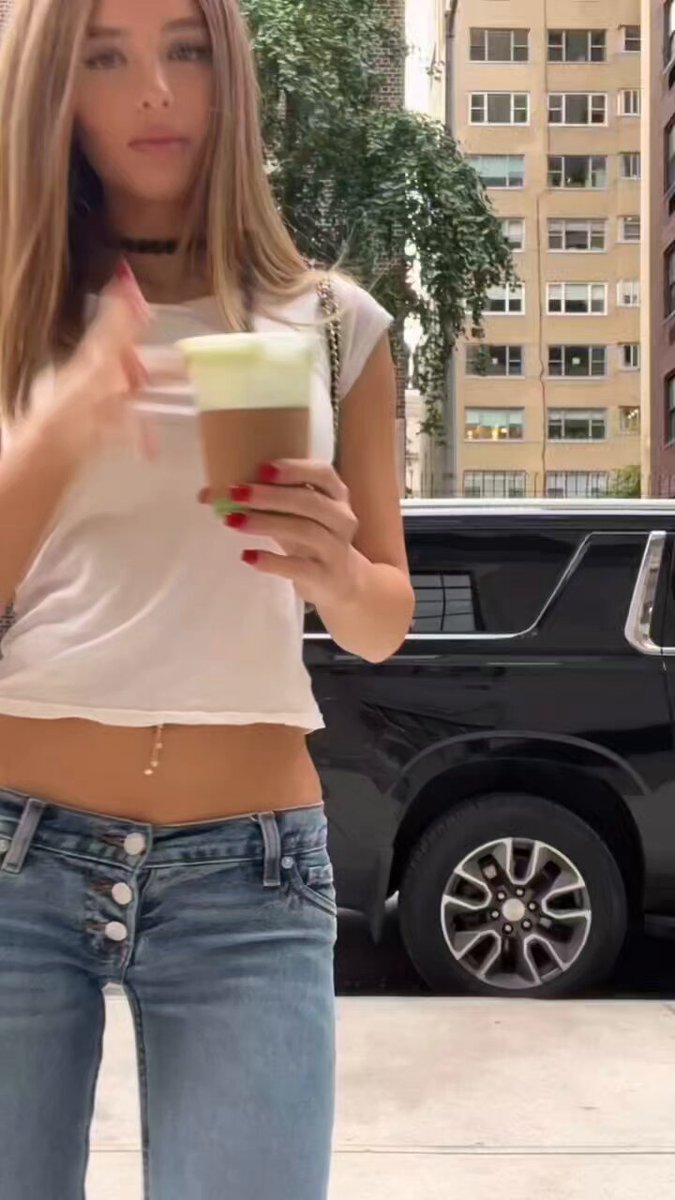 Blonde in a white crop top holding a coffee (@whodoiwannabee)
