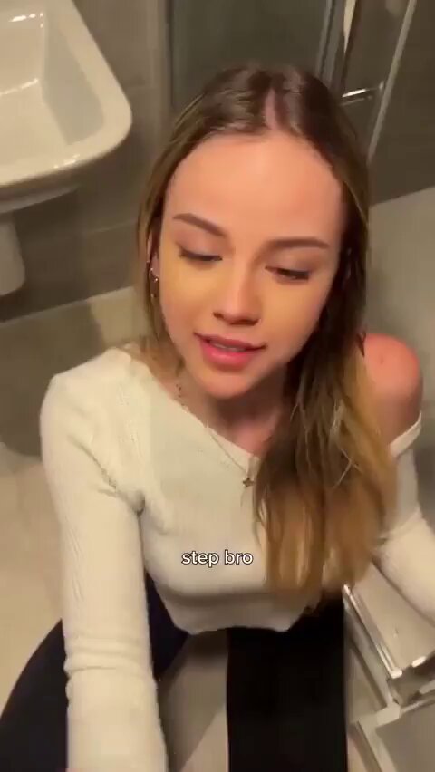 Brunette in a white top at a bathroom mirror (@qwertypolypo)