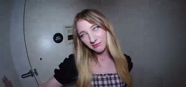 Blonde in a plaid dress by a door (@alejandro_mijan)